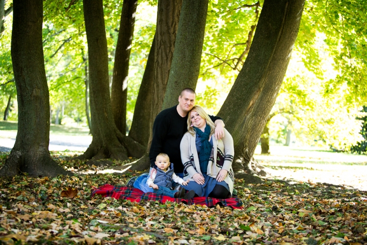 Family and child portrait taken in the woods at Delaware Park.